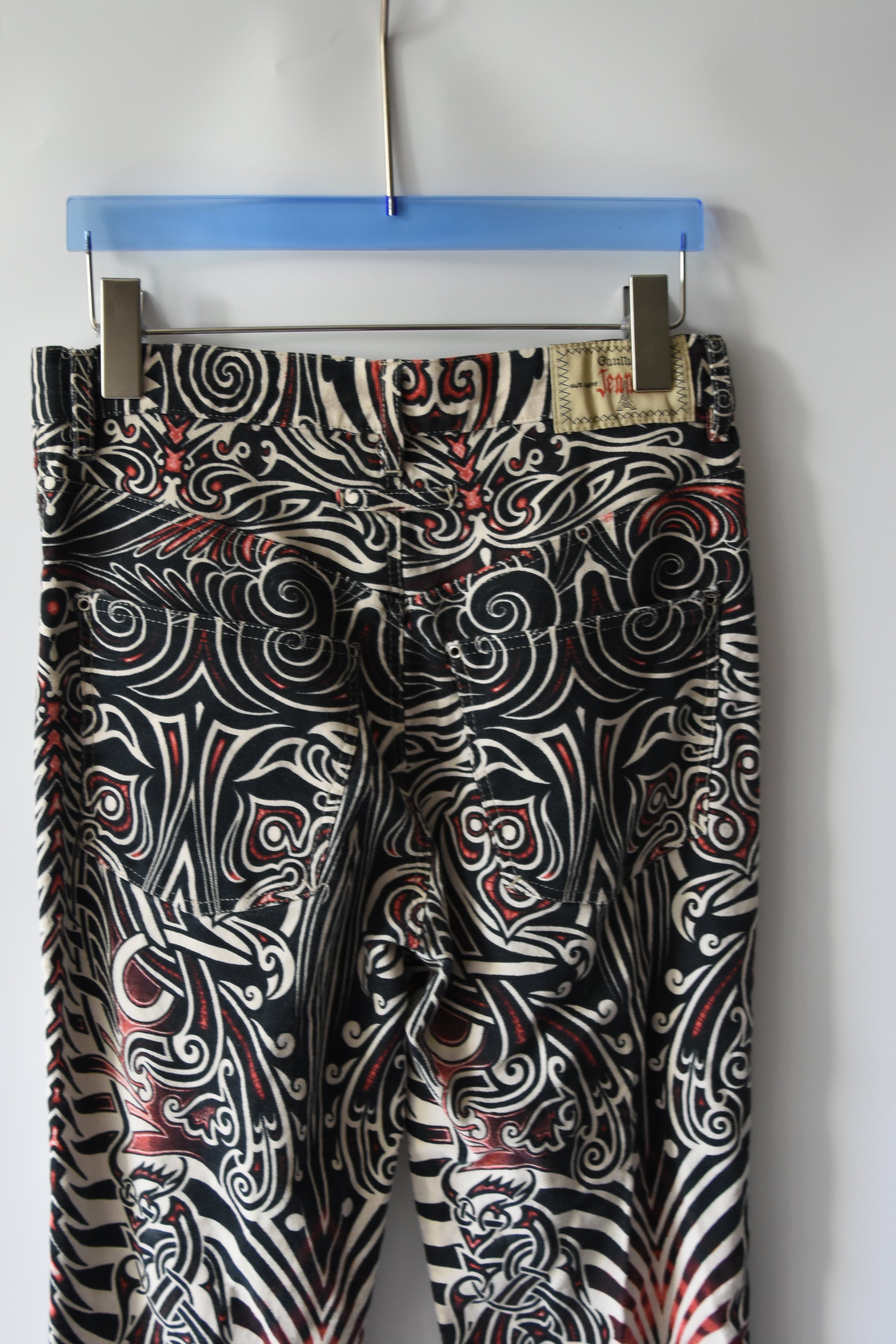 Jean Paul Gaultier Jeans Tribal Print Flared Trousers (Gothic Tattoo Swirl in Black–Red–Ivory)