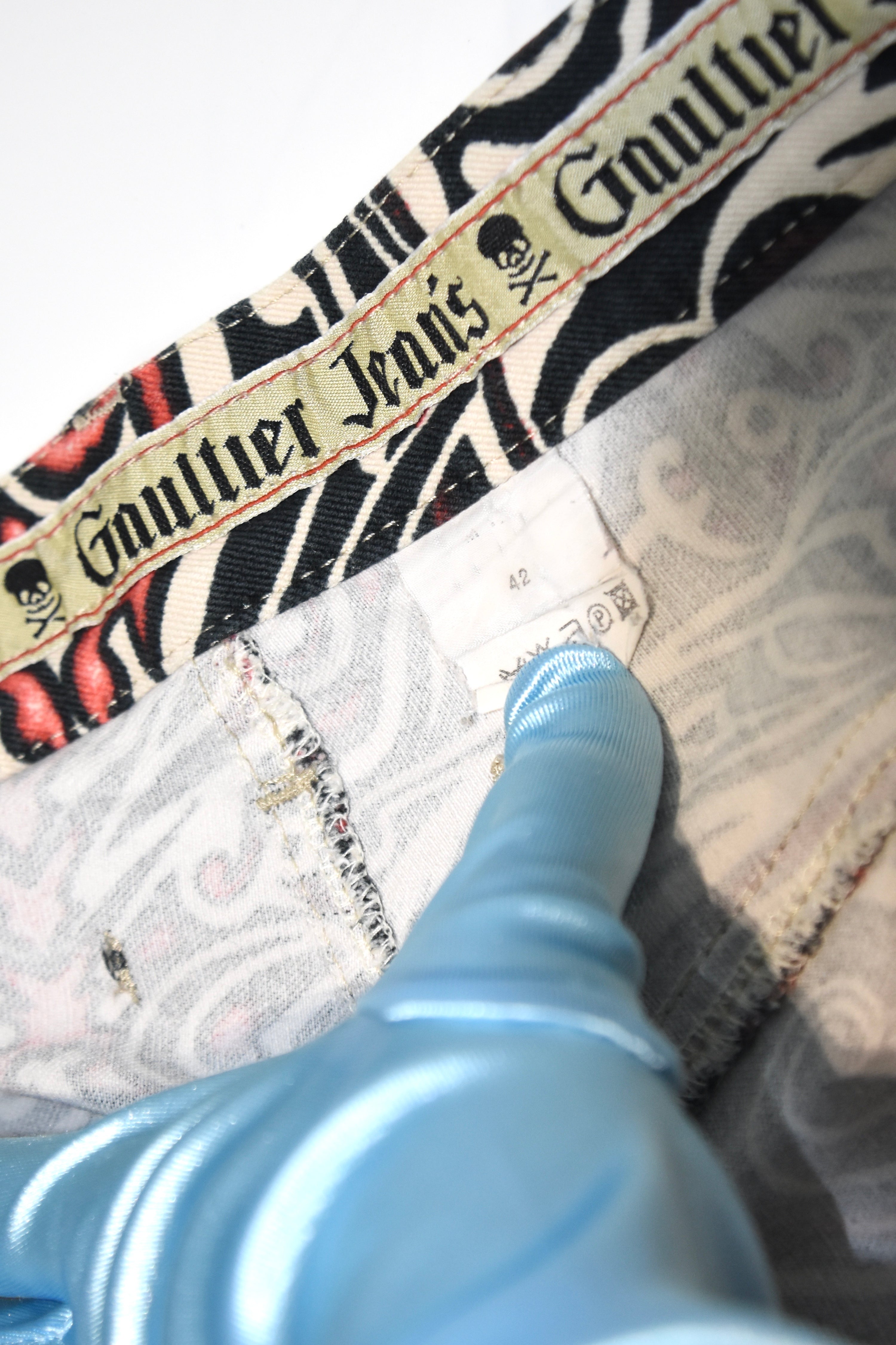 Jean Paul Gaultier Jeans Tribal Print Flared Trousers (Gothic Tattoo Swirl in Black–Red–Ivory)