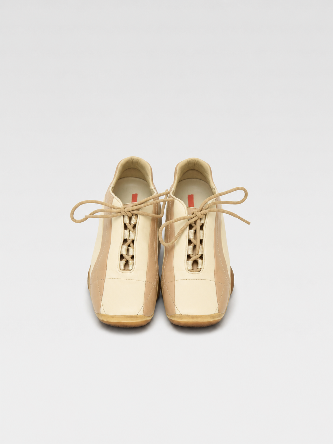 PRADA Beige & Cream Leather Lace-Up Low Sneakers with Red Tab Detail (Classic Sporty Silhouette)