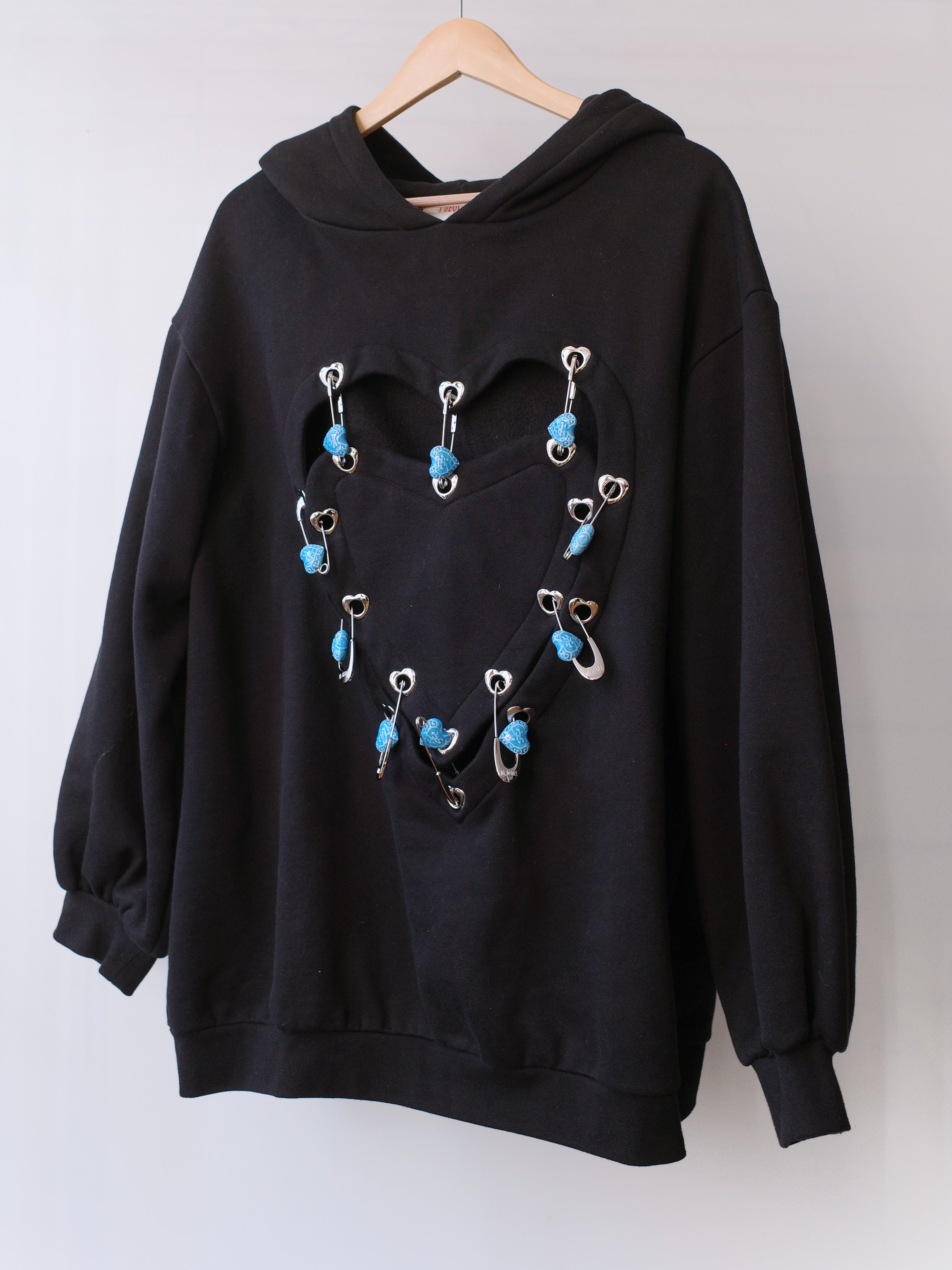 YUEQI QI Heart Cutout Hoodie with Blue Safety Pin Details