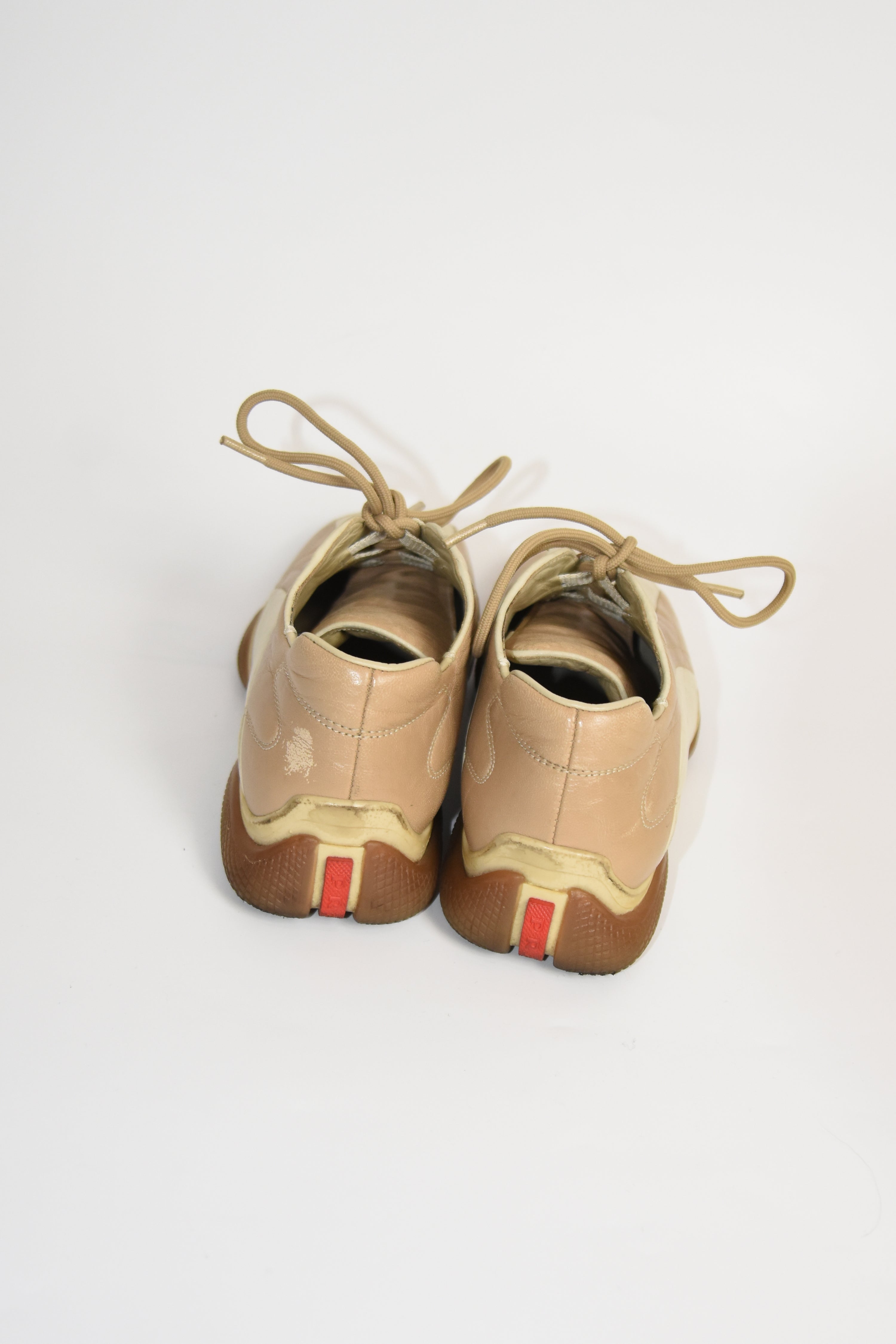 PRADA Beige & Cream Leather Lace-Up Low Sneakers with Red Tab Detail (Classic Sporty Silhouette)