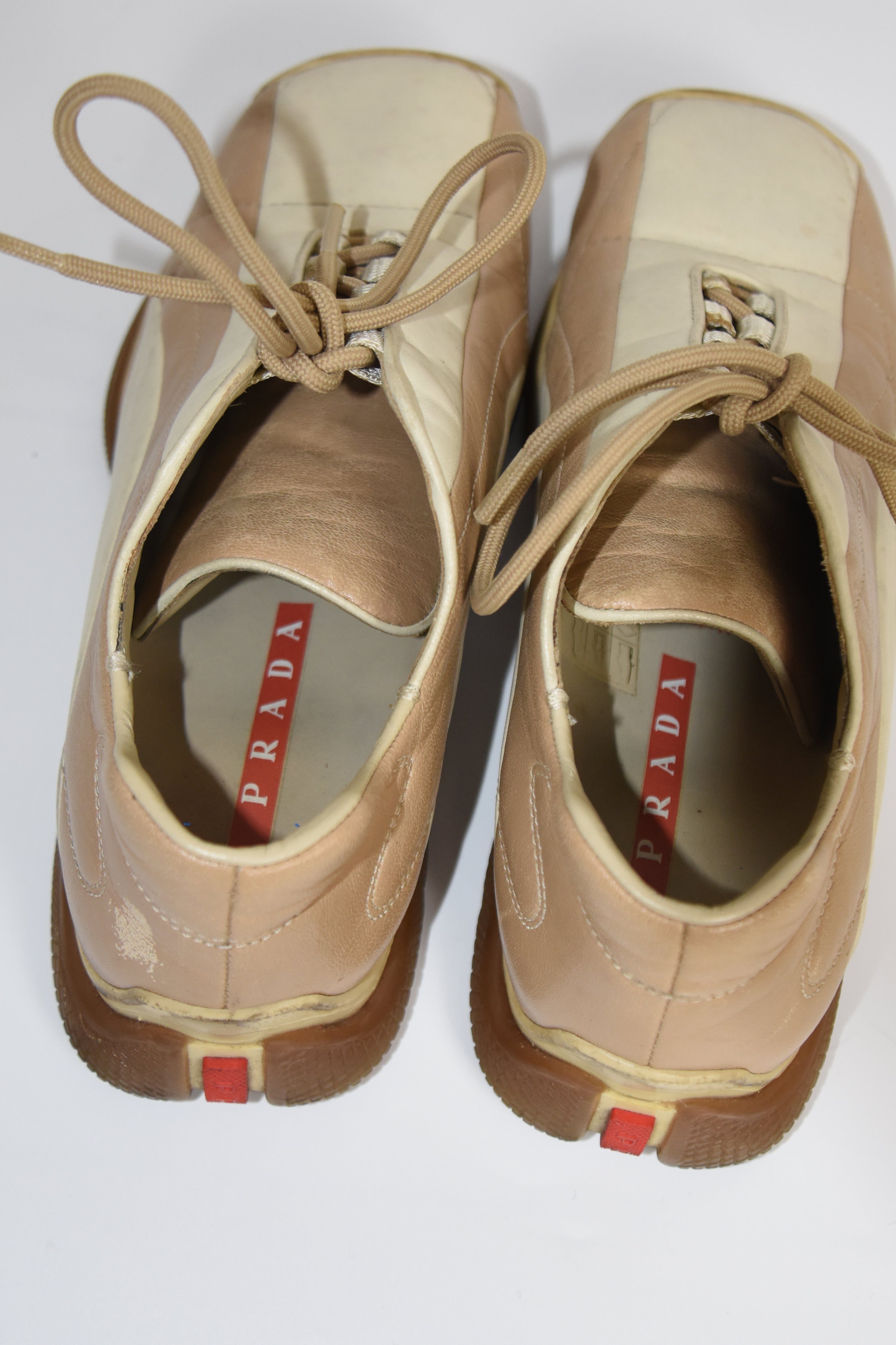 PRADA Beige & Cream Leather Lace-Up Low Sneakers with Red Tab Detail (Classic Sporty Silhouette)