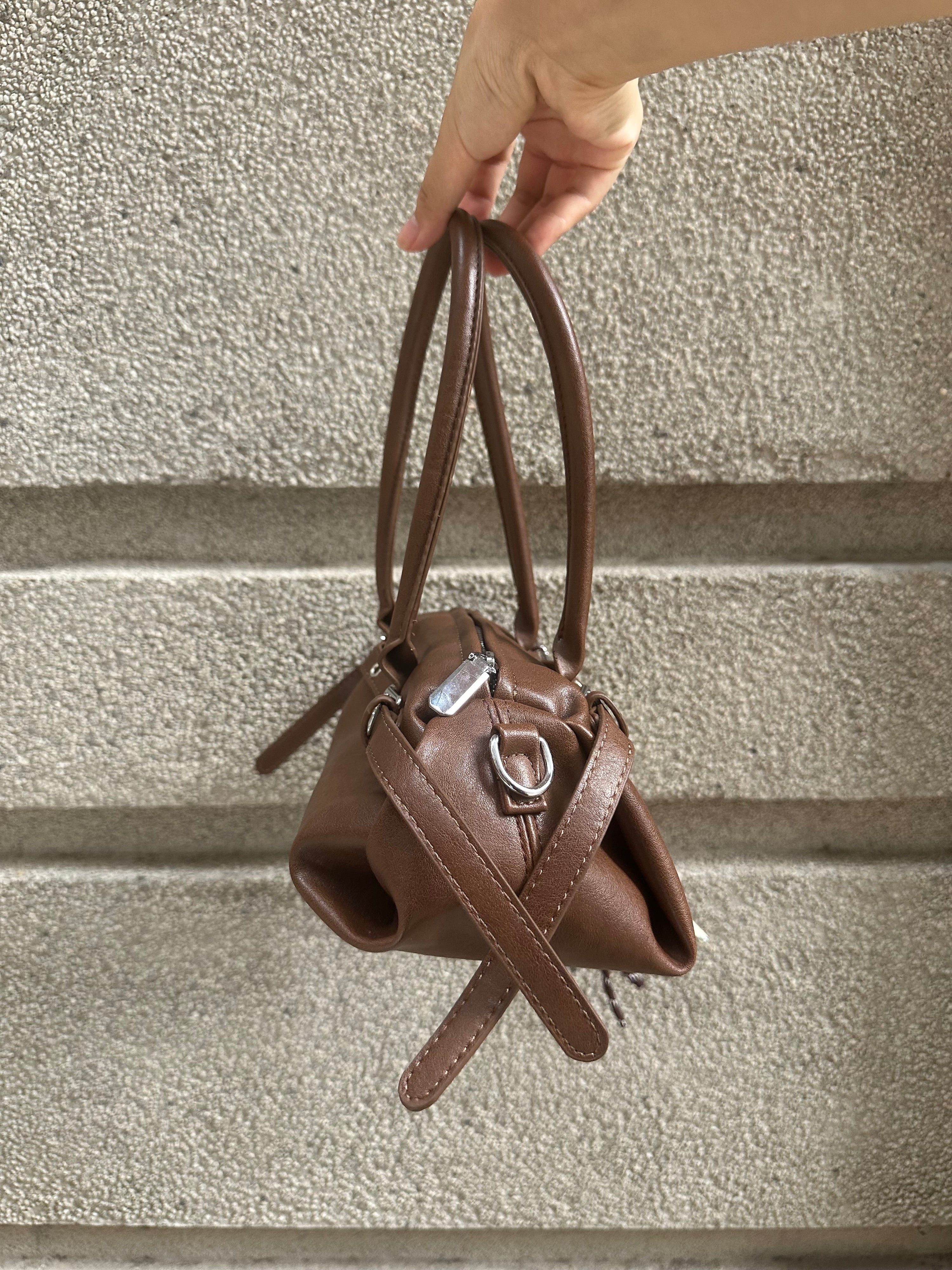 Brown Leather Buckle-Detail Handbag with Rope Charm
