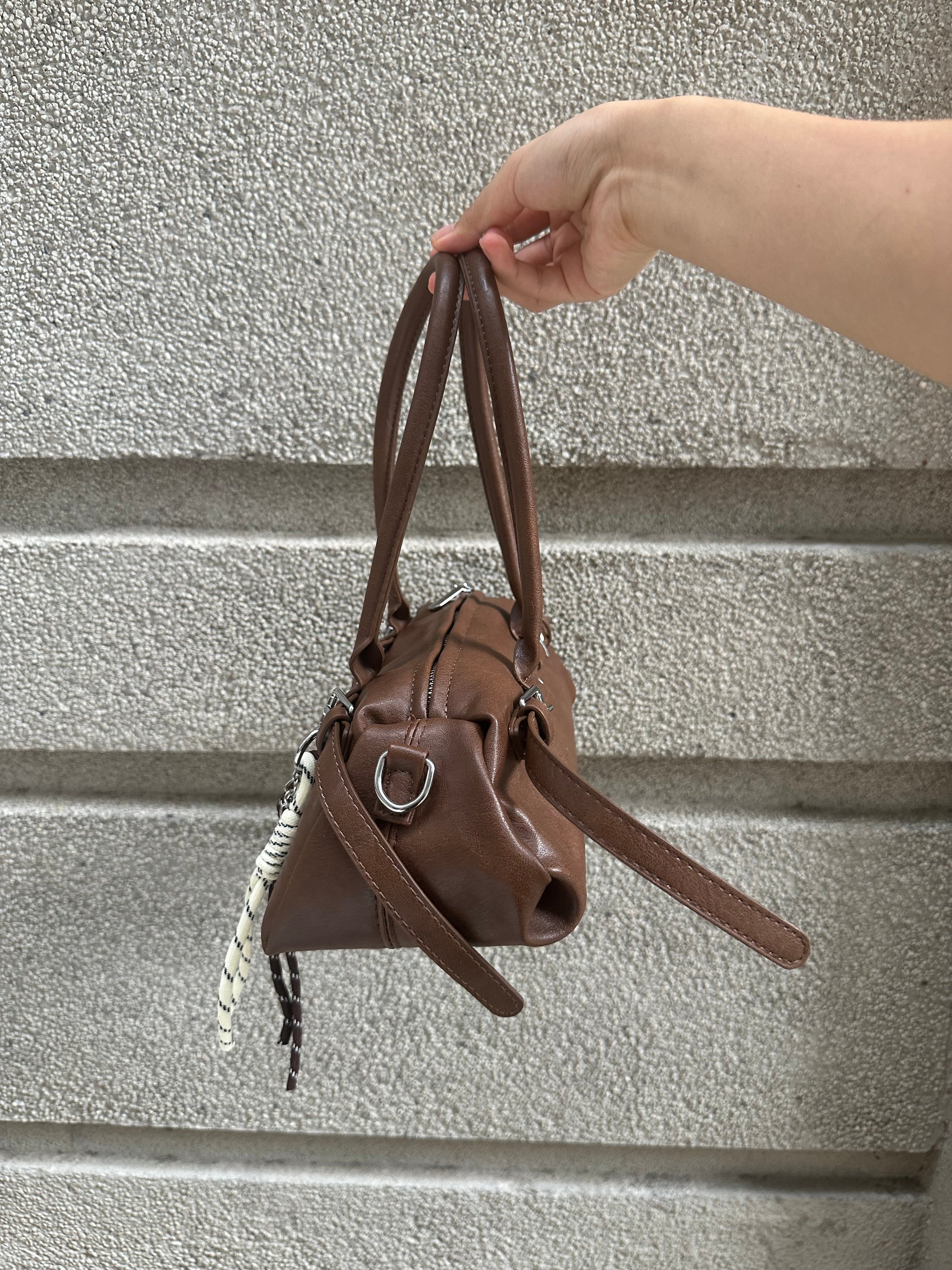 Brown Leather Buckle-Detail Handbag with Rope Charm
