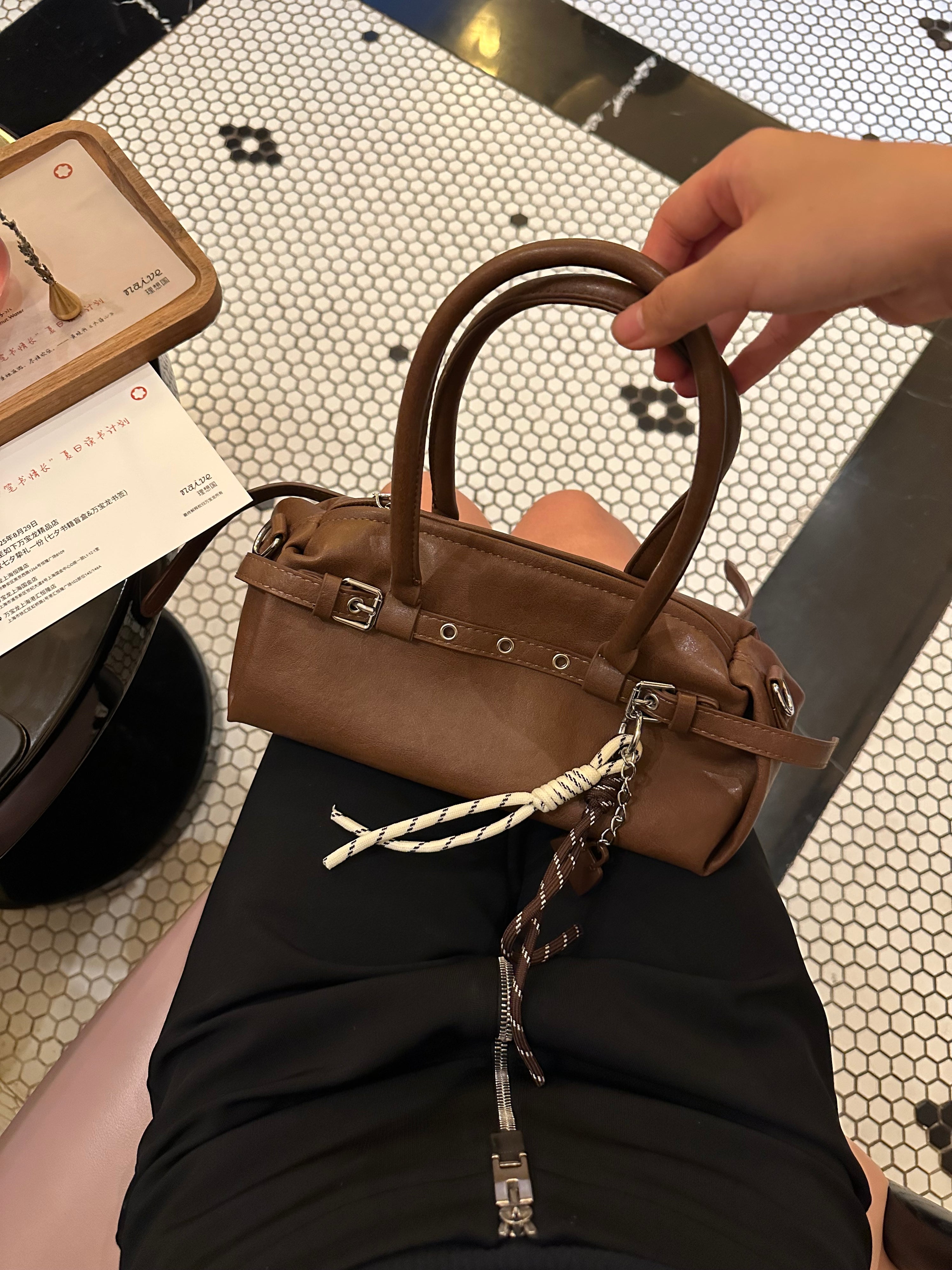 Brown Leather Buckle-Detail Handbag with Rope Charm